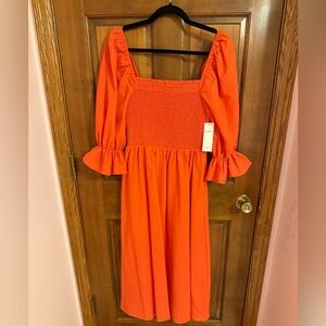 Aura Orange Midi Dress with Smocked Bodice and Puff Sleeves